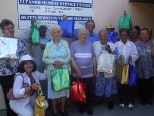 Buffeslfontein residents very happy with their Christmas hampers from Annemarie Craven. Annemarie Craven and her family have provided 100 Christmas hampers every year for the past 4 years.